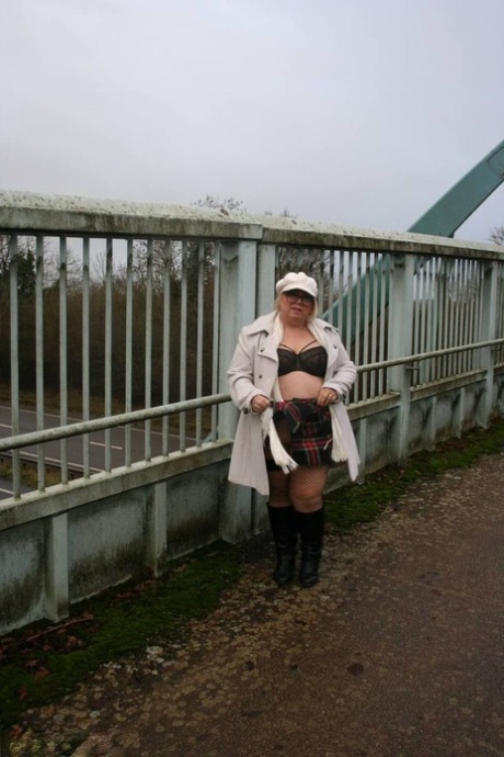 A large anus is displayed by Lexie Cummings, a fat UK resident, while standing on a pedestrian bridge.