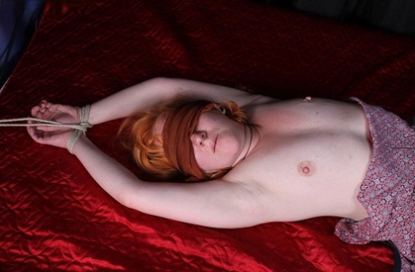 Pale Redhead Florence Is Blindfolded While Restrained With Rope On A Bed