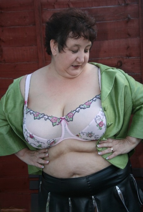 Fat Older Woman Kinky Carol Models A Bra And Microskirt In Over The Knee Boots