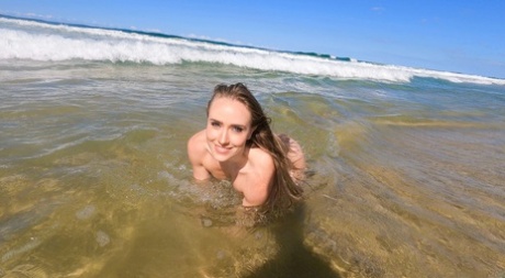 A girl with no one but herself, Scarlet Chase, shows her affection by doffing her bikini while at the beach.