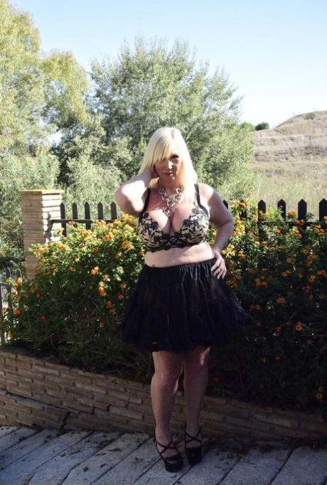Blonde Granny Melody Exposes Her Overweight Body In An English Garden