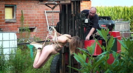 The white girl's face is pricked from being suspended from a forklift.