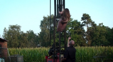 After being suspended from a forklift, the young white girl's face is now covered with air.