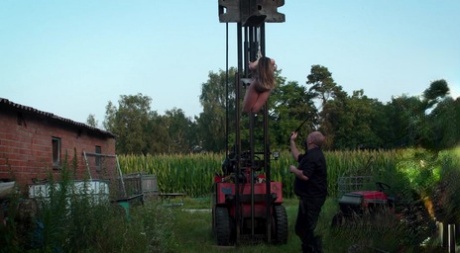 A young white girl's face is pricked from being suspended from a forklift.