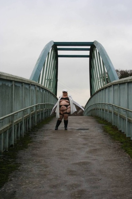 A pedestrian bridge leads Lexie Cummings, a plump British woman, to herself.
