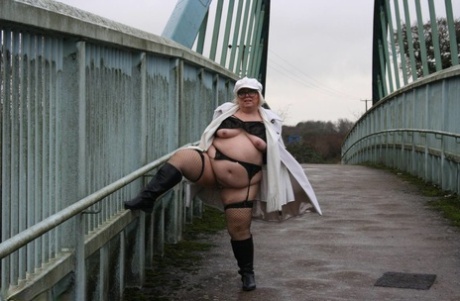 Exposed on a bridge for pedestrians, Lexie Cummings is an overweight British woman.