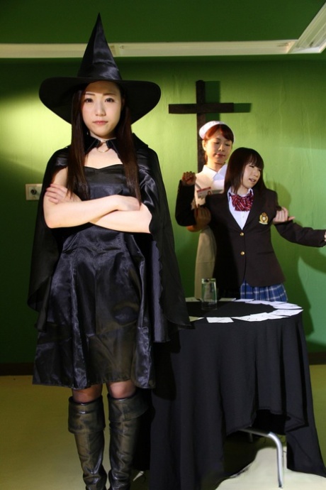 Japanese young women engage in cosplay costumes and perform the dark arts.