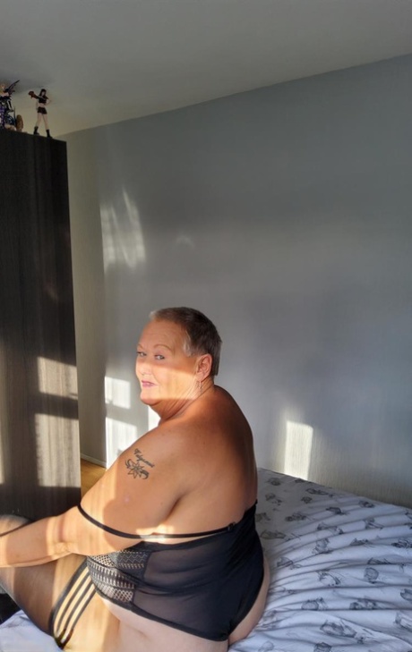 Overweight Granny Valgasmic Exposed Uncovers Her Boobs On Her Bed In Stockings