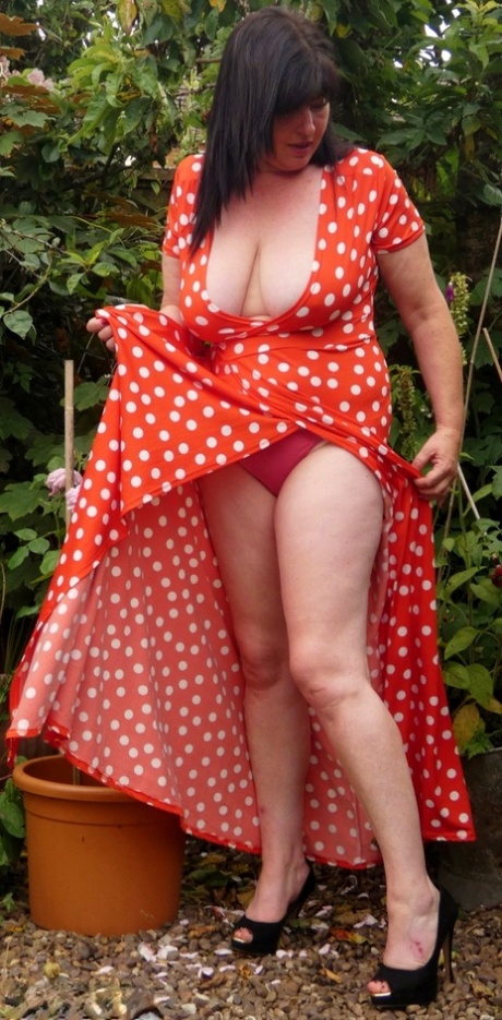 Juicey Jane, an amateur gardener from the UK, bares herself while tending to her plants.