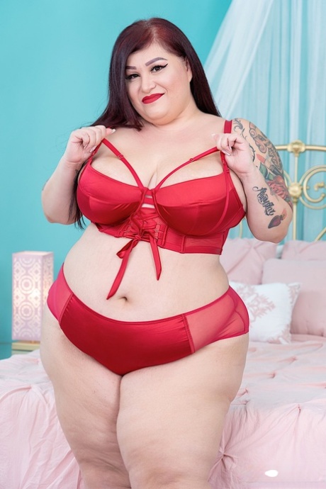 Obese Redhead Monique Lustly Ditches A Red Bra And Panty Set To Get Naked