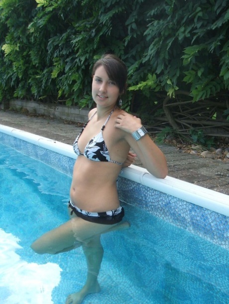 Amateur chick Roxy glances at her Morgan watch while in a swimming pool