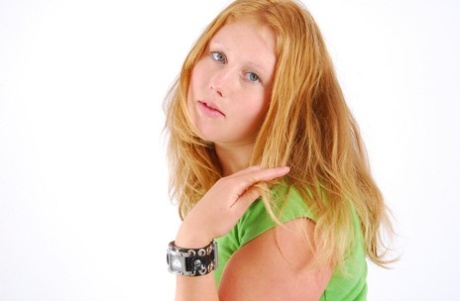 During SFW action, Judy, a natural redhead, models a double buckle cuff watch.