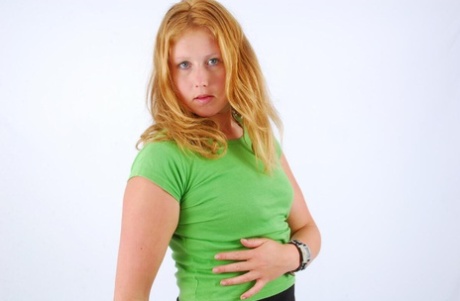 The natural redhead, Judy, models a double buckle cuff watch during SFW action.