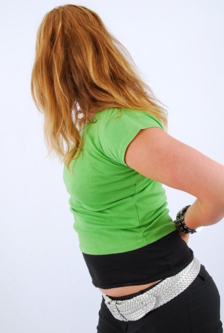 A double buckle cuff watch is worn by natural redhead Judy while participating in SFW action.