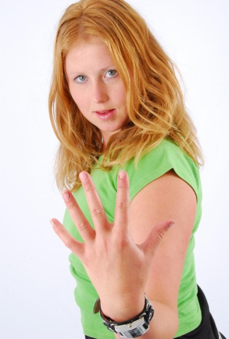 Natural redhead Judy wears a double buckle watch while participating in SFW action.