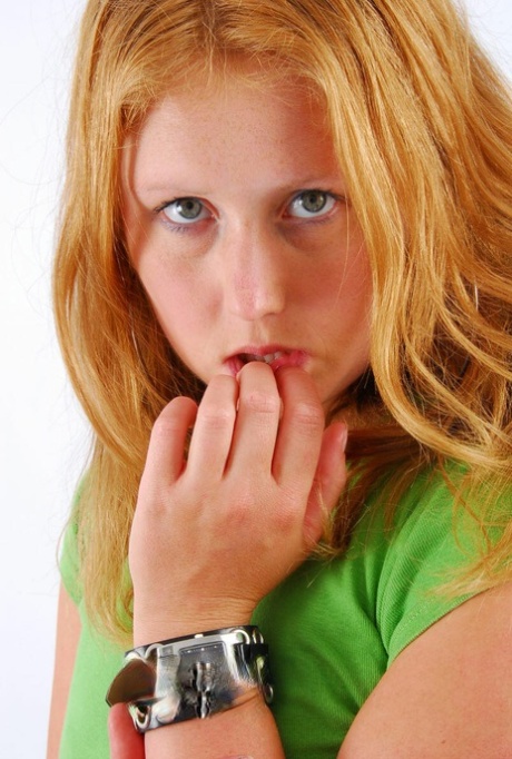 Judy, a natural redhead at her most vulnerable, wears a double buckle cuff watch during SFW action.