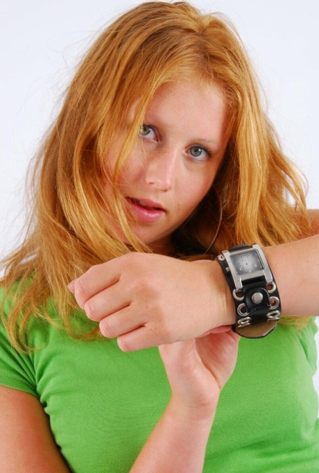 In SFW action, Judy (an natural redhead) models a watch with double buckle on the wrist.