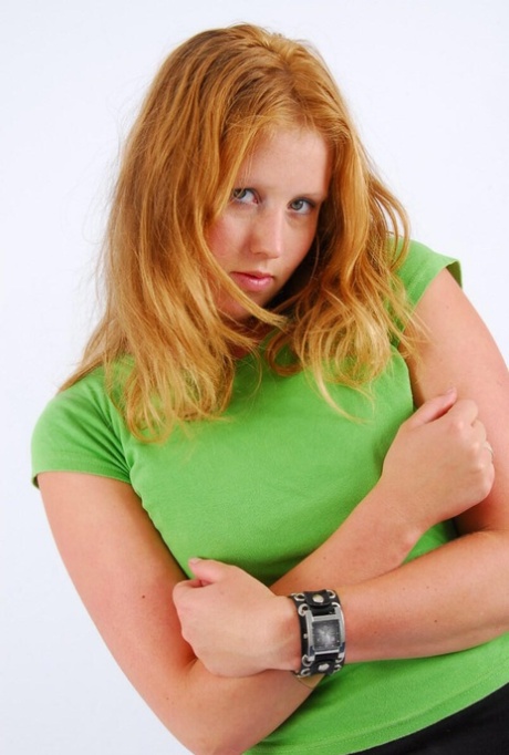 SFW action involves Judy, a naturally redhead, wearing the watch with its double buckle and cuff.