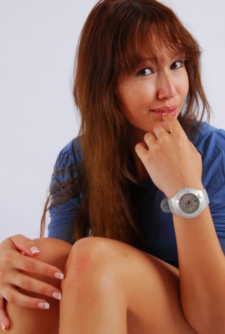 Asian model with red hair poses for a non-nude gig in a Swatch Scuba watch