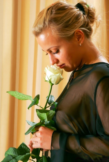 Blonde Teen Lory Holds A Long Stem Rose While Getting Bare Naked