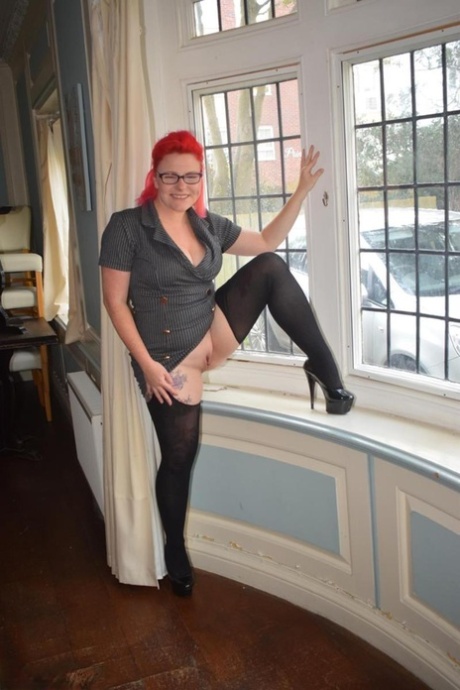 Wearing crotchless pantyhose, Mollie Foxxx is seen as a middle-aged amateur.