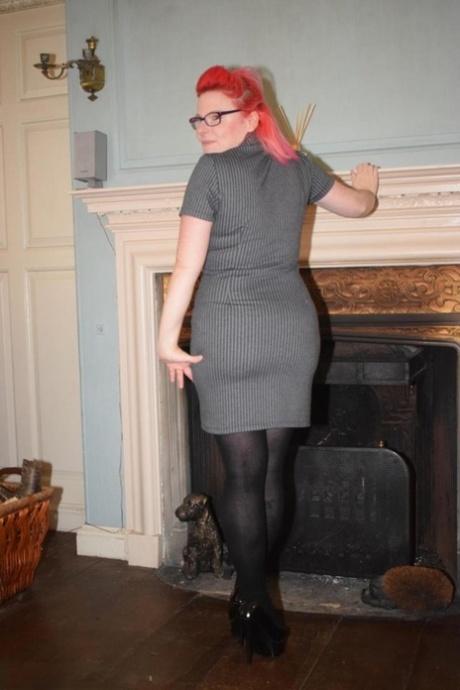Dressed in pantyhose without a bottom, Mollie Foxxx, an aged amateur, shows off her legs.