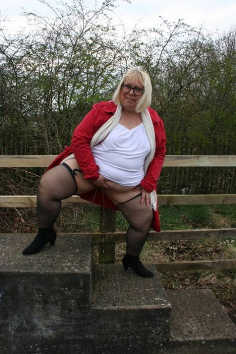 Exorcising in public places, Lexie Cummings, an obese British woman, displays her body.