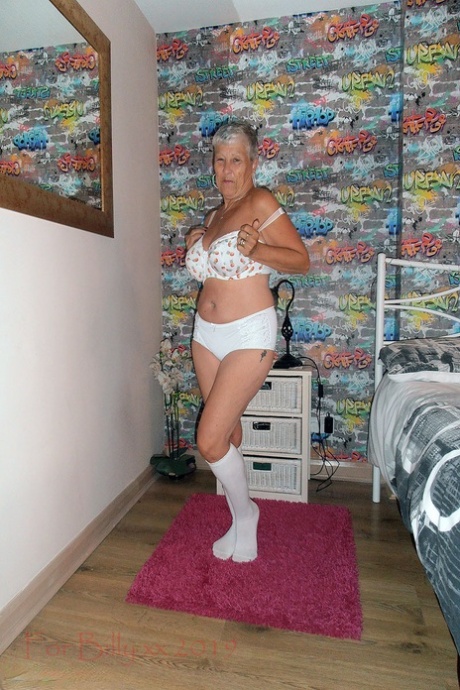 Savana's silver-haired grandmother bares white socks at her knees in the bedroom.