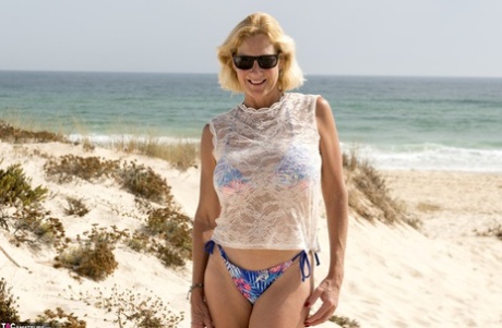 Mature Blonde Molly MILF Strips Totally Naked On A Sandy Beach