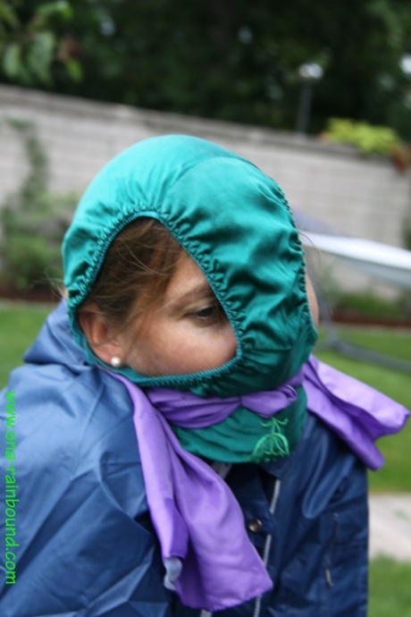 Black woman tied to table in front of the yard with panties draped over her face.