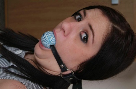 In a ball gag performed by Brunette woman Randy Star, she is tied up with rope.