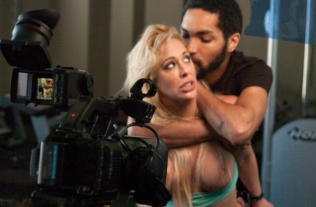 An athlete's blonde partner is forced into bondage sex by a photographer.