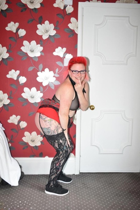 With her big, thick red hair on her back, Mollie Foxxx enjoys cuddling on a chair and playing with toys.