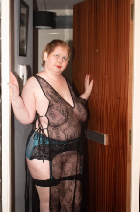 While removing her lingerie, the Posh Sophia, an older dog with fatty skin, enjoys playing with her massive breasts.