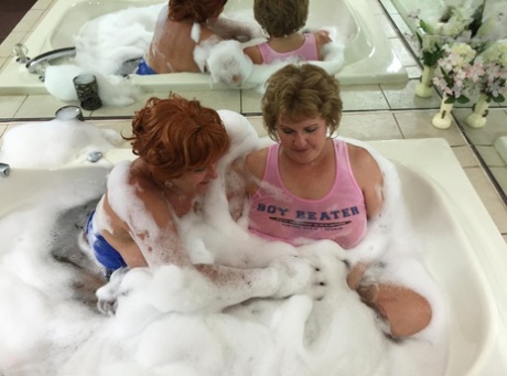 In a bubble bath, Busty Bliss, an older self-confessed amateur, has sex with women.