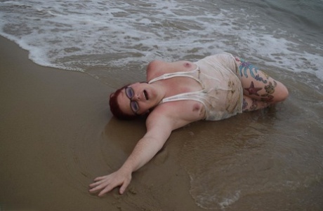 Mature Redhead Mollie Foxxx Wets Her Tattooed Body In The Ocean