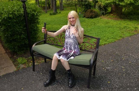 Blonde teen Celestina Blooms takes selfies while getting naked in black boots