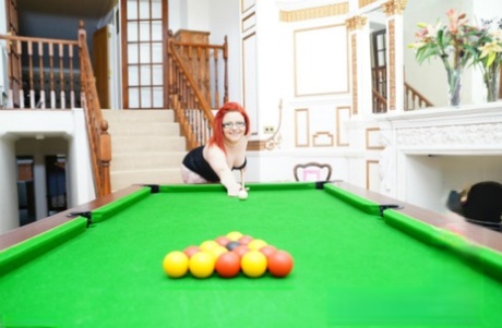 Mollie Foxxx, an amateur girl, and her girlfriend of the same gender engage in pool competitions while wearing lingerie.