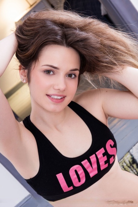 Sweet teen Trixy gets completely naked during a workout session