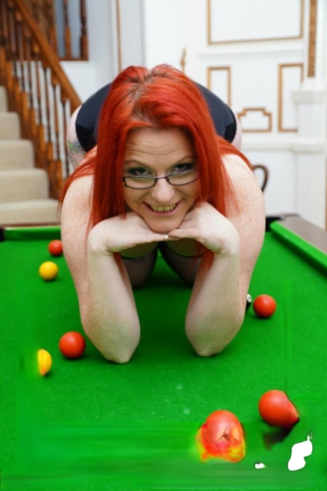 On a pool table, Mollie Foxxx has been engaging in sexual activity with a lesbian partner while being an outwardly-looking redhead.