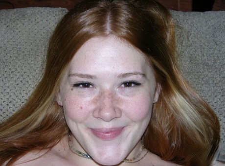 Young Redhead Harper Red Barely Suppresses A Smile While Going Nude