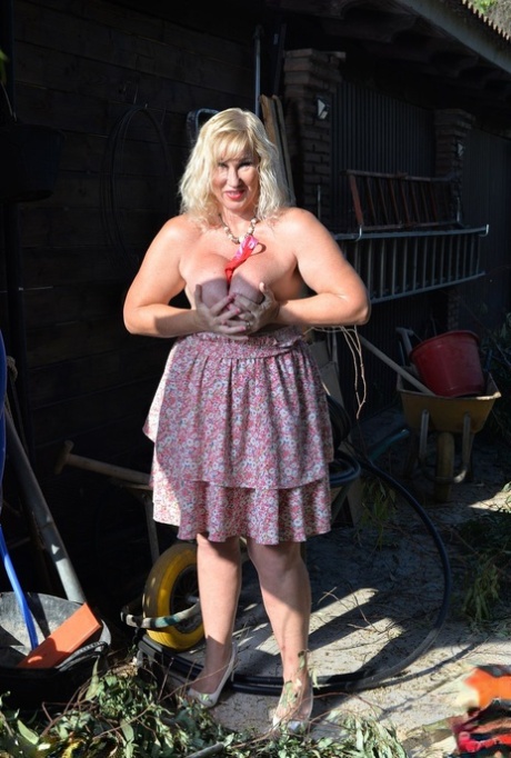 In a disorderly backyard, Melody showcases her big tits and buttocks, who are overweight and older than her age.