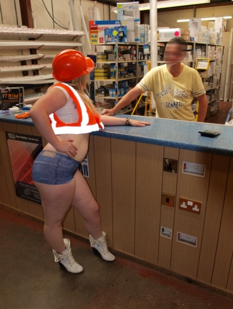 On the counter at a hardware store, Samantha, who is blonde and fatty, gets naked.