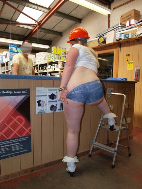 Striking blonde Samantha exposes herself on the hardware store counter.