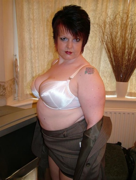 Using nylons to cover her back seam, Double Dee expose herself while wearing an overweight British woman's skirt.