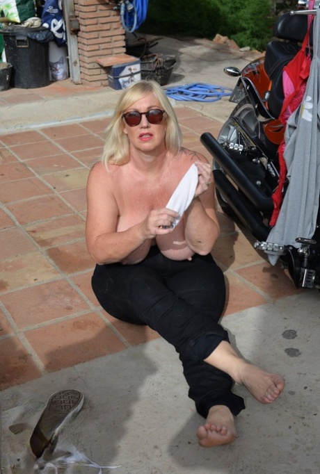 Aged 28, blonde Melody severs her hair into a Thong and shades to blend with an eye-catching motorcycle.