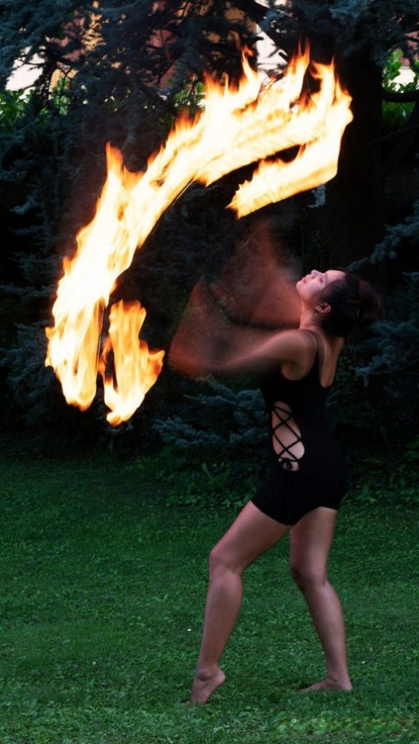 A finger fuck is performed by young fire performer Savana, who shows off her svelte body.