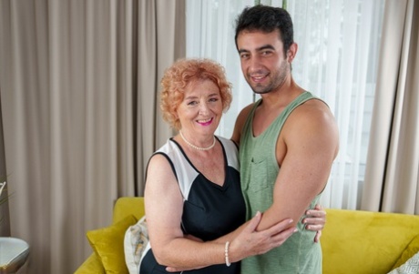 Old Lady With Short Red Hair Has Sex On A Sofa With A Young Lad