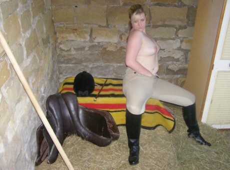 Amateur female Samantha throws her riding clothes to the side in a naked on-and-off tack box.