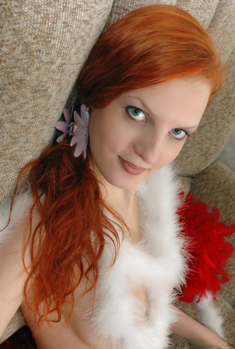 Young redhead Galea is dressed in garland during her nude modelling gig.